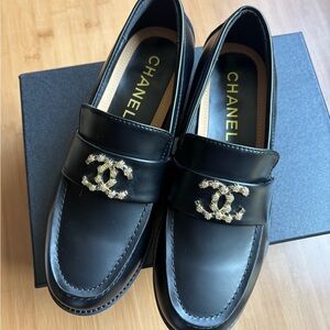 CHANEL Black Leather Loafers with Gold CC Embellishment